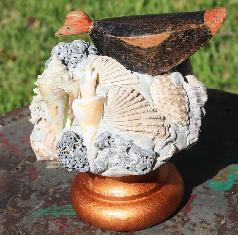 Antique Bird Resting On Sea Shells